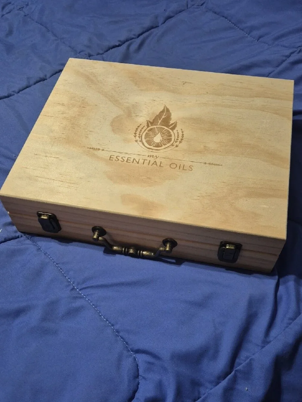 ​Wooden essential oils storage box with laser-engraved logo. Light natural wood